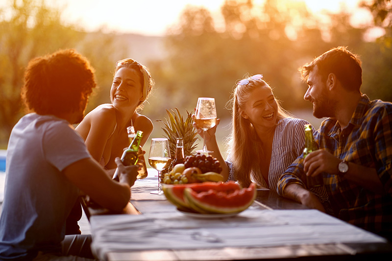 A group of friends gathering at a picnic table
